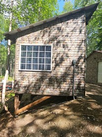 Relaxing Mini Cabin Hideaway with Campground Amenities, Play Area & Firepit in Houston, Alaska - glamping.directory