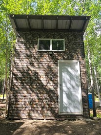 Relaxing Mini Cabin Hideaway with Campground Amenities, Play Area & Firepit in Houston, Alaska - Houston, Alaska - glamping.directory