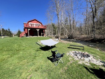Tranquil Cabin Hideaway with Firepit and Riverfront Views on the Green River in Vermont - glamping.directory