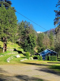Beautiful Blue Cabin Nestled on a Hill with Beautiful Mountain Views for a Relaxing Getaway by the Trinity River in California - glamping.directory
