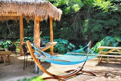 Deluxe Safari Tent Cabin with Creek Swimming, Fishing & Resort-Style Amenities in Marion, Texas - Marion, Texas - glamping.directory