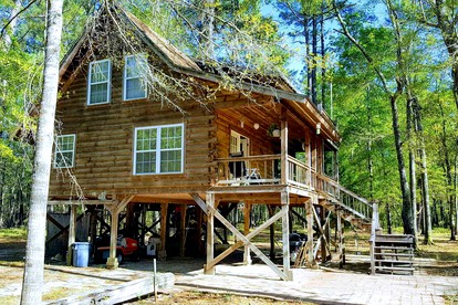 Claxton's Riverfront Family Fun: Cabin Adventures Await - glamping.directory