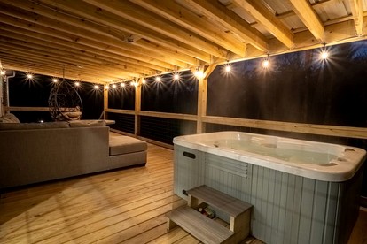 Tranquil Riverfront Retreat with Hot Tub near Waterfalls & Pisgah National Forest, Brevard NC - Balsam Grove, North Carolina - glamping.directory