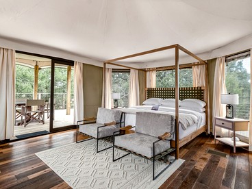 Incredible Glamping Lodge with Spacious Lounge and BBQ on the Wrap-Around Deck in Stonewall, Texas - glamping.directory