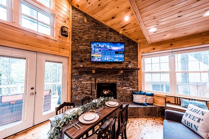 Luxurious Pet Friendly Treehouse with Hot Tub Nestled within the Pine Trees by the Waterfront of Belgrade Stream, Close to Sugarloaf Mountain, Maine - Belgrade, Maine - glamping.directory