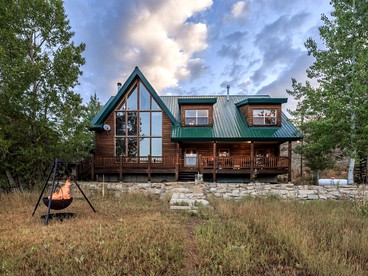 Waterfront Log Cabin Rental with Wood-Burning Stove near Salt Lake City, Utah - glamping.directory