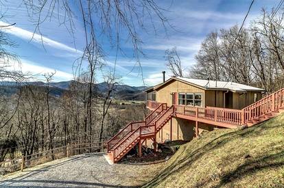 Cozy Log Cabin Retreat with Mountain Views near Cataloochee Ski Area in Waynesville, NC - glamping.directory