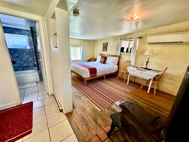 Charming Log Cabin Rental on Eco-Farm near Taos Ski Valley - Taos Ski Valley, New Mexico - glamping.directory