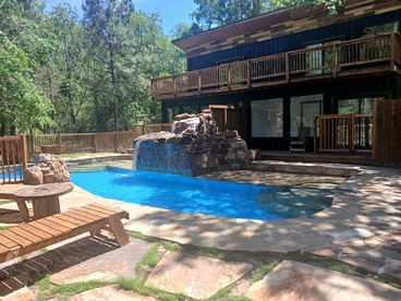 Serene Forest Retreat Home with Waterfall Pool, Creek & Kayak Access near Houston, Grimes County, Texas - glamping.directory