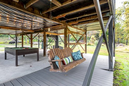 Riverfront Cabin with Pool Table, Fire Pit and Plenty of Outdoor Space in Hedgesville, West Virginia - Hedgesville, West Virginia - glamping.directory