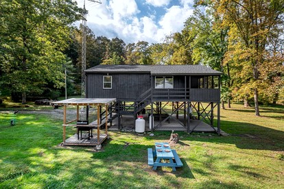 Riverfront Cabin with Pool Table, Fire Pit and Plenty of Outdoor Space in Hedgesville, West Virginia - glamping.directory
