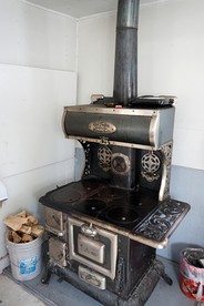 Simple Country Cabin with Ornate Wood Stove in the Colorado Mountains of Poudre Canyon - Bellvue, Colorado - glamping.directory