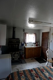 Simple Country Cabin with Ornate Wood Stove in the Colorado Mountains of Poudre Canyon - Bellvue, Colorado - glamping.directory