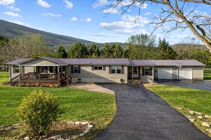 Spacious Family Retreat with Game Room, Fire Pit & River Access Nearby in Cabins, West Virginia - glamping.directory