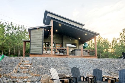 Electrifying Family Cabin with Mini Golf, Arcades & EV Charger Near Beavers Bend State Park | Broken Bow, Oklahoma - glamping.directory