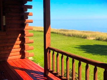 Fantastic Lakeside Log Cabin Rental for Six in Cedar River, Michigan - Cedar River, Michigan - glamping.directory