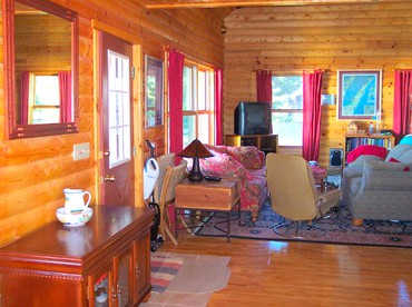 Fantastic Lakeside Log Cabin Rental for Six in Cedar River, Michigan - Cedar River, Michigan - glamping.directory
