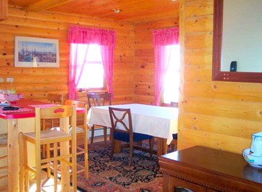 Fantastic Lakeside Log Cabin Rental for Six in Cedar River, Michigan - Cedar River, Michigan - glamping.directory