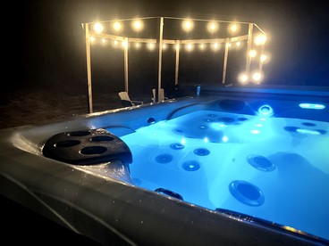 Secluded Rustic Cabin with Hot Tub Near Pere Marquette River in Big Rapids, Michigan - Big Rapids, Michigan - glamping.directory