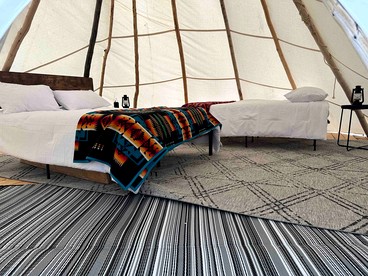 Rustic Elegance: Tipi Glamping by Wind River Mountains in Fort Washakie - Fort Washakie, Wyoming - glamping.directory