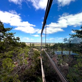 Stunning Mirror-Glass Retreat with Spa Tub & Sunset Deck in Cottonwood, Texas - Cottonwood Shores, Texas - glamping.directory