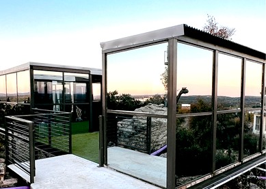 Stunning Mirror-Glass Retreat with Spa Tub & Sunset Deck in Cottonwood, Texas - Cottonwood Shores, Texas - glamping.directory