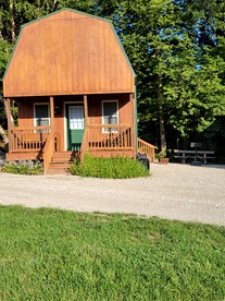 Comfortable Camping Cabins with View of the Cedar River for a Family Weekend Getaway - glamping.directory