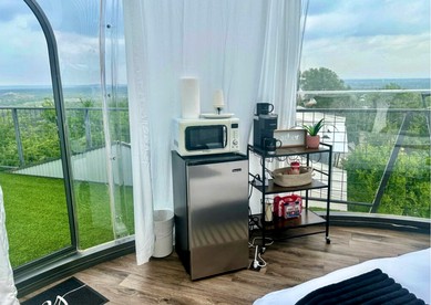 Luxury Glass A-Frame Escape with Cliffside Balcony & Spa Features in Cottonwood Shores, Texas - Cottonwood Shores, Texas - glamping.directory