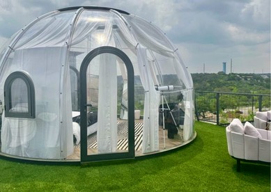 Luxury Glass A-Frame Escape with Cliffside Balcony & Spa Features in Cottonwood Shores, Texas - Cottonwood Shores, Texas - glamping.directory