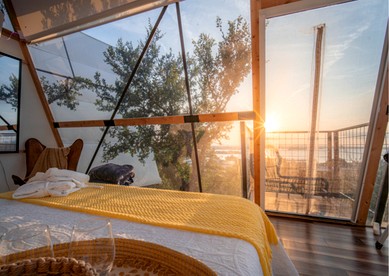 Luxury Glass A-Frame Escape with Cliffside Balcony & Spa Features in Cottonwood Shores, Texas - Cottonwood Shores, Texas - glamping.directory