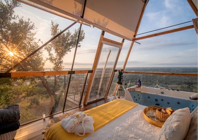 Luxury Glass A-Frame Escape with Cliffside Balcony & Spa Features in Cottonwood Shores, Texas - Cottonwood Shores, Texas - glamping.directory