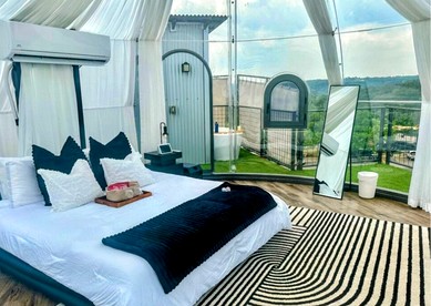Luxury Glass A-Frame Escape with Cliffside Balcony & Spa Features in Cottonwood Shores, Texas - Cottonwood Shores, Texas - glamping.directory