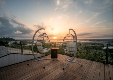 Luxury Glass A-Frame Escape with Cliffside Balcony & Spa Features in Cottonwood Shores, Texas - Cottonwood Shores, Texas - glamping.directory