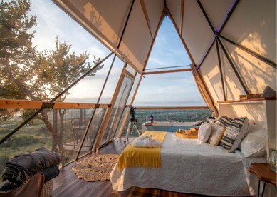 Luxury Glass A-Frame Escape with Cliffside Balcony & Spa Features in Cottonwood Shores, Texas - glamping.directory