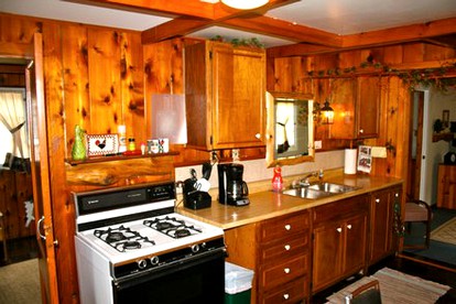 Wonderful Cabin with Lake Access, Barbecue and Tennis Court in Carp Lake, Michigan - Carp Lake, Michigan - glamping.directory
