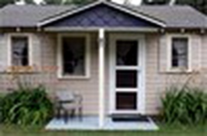 Wonderful Cabin with Lake Access, Barbecue and Tennis Court in Carp Lake, Michigan - glamping.directory