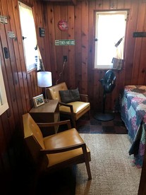 Wonderful Cabin with Lake Access, Barbecue and Tennis Court in Carp Lake, Michigan - Carp Lake, Michigan - glamping.directory