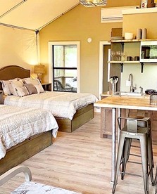 Cibolo Waterside Delight: Tented Cabin Glamping with Comfortable Shared Spaces - Cibolo, Texas - glamping.directory
