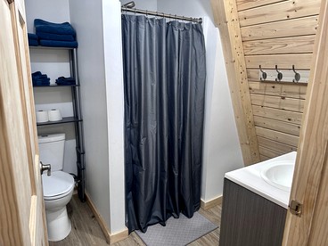 Lofted A-Frame Cabin with Direct Lake Access and Equipped Deck in Michigan - Au Gres, Michigan - glamping.directory