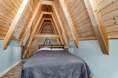 Lofted A-Frame Cabin with Direct Lake Access and Equipped Deck in Michigan - Au Gres, Michigan - glamping.directory