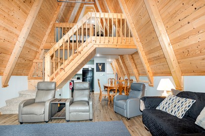 Lofted A-Frame Cabin with Direct Lake Access and Equipped Deck in Michigan - Au Gres, Michigan - glamping.directory