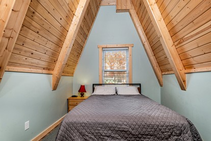 Lofted A-Frame Cabin with Direct Lake Access and Equipped Deck in Michigan - Au Gres, Michigan - glamping.directory