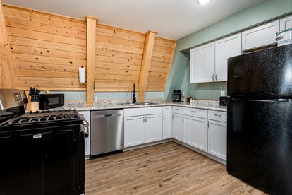 Lofted A-Frame Cabin with Direct Lake Access and Equipped Deck in Michigan - Au Gres, Michigan - glamping.directory