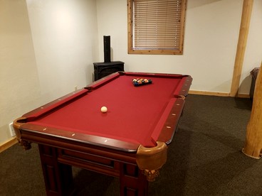 Luxurious Forest Cabin with Hot Tub and Game Room Near Outdoor Adventures in Island Park, Idaho - Idaho City, Idaho - glamping.directory