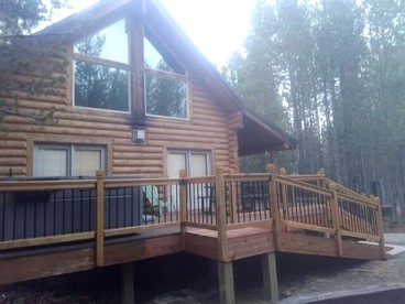 Luxurious Forest Cabin with Hot Tub and Game Room Near Outdoor Adventures in Island Park, Idaho - glamping.directory