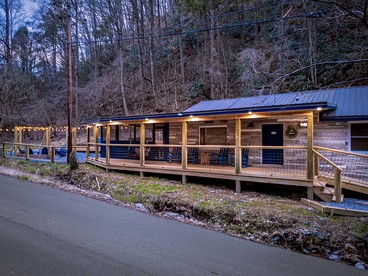 Smoky Mountain Cabin Retreat with Hot Tub, Game Room, Mini Golf & Creek Views in Pigeon Forge, Tennessee - glamping.directory