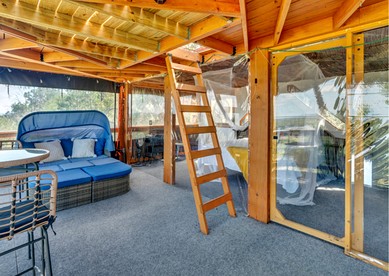 Epic Treehouse Escape with Multi-Level Deck & Hanging Bed in Cottonwood, Texas - Cottonwood Shores, Texas - glamping.directory