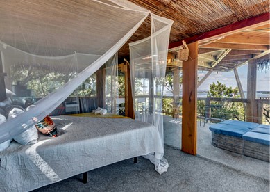 Epic Treehouse Escape with Multi-Level Deck & Hanging Bed in Cottonwood, Texas - Cottonwood Shores, Texas - glamping.directory