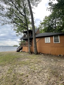Rustic Pet-Friendly Cabin with Fire Pit on the Beach of Sebago Lake, Maine - Sebago, Maine - glamping.directory