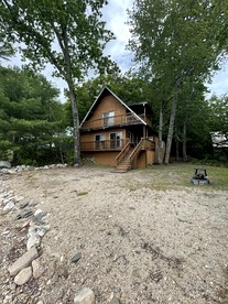 Rustic Pet-Friendly Cabin with Fire Pit on the Beach of Sebago Lake, Maine - glamping.directory